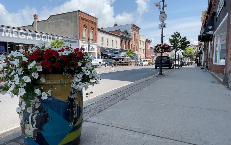 downtown Gananoque Ontario wooden barrels bursting with flowers